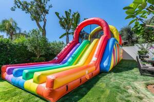 AI generated Colorful bounce slide for children entertainment in backyard photo