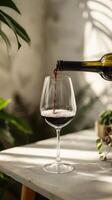 Wine Pouring Into Glass Against Rustic Background photo