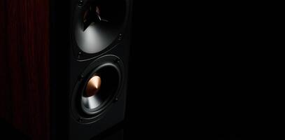 Multimedia acoustic sound speaker on dark background photo