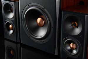 Sound audio system with two satellites and subwoofer on dark background. photo