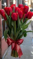 AI generated Red Tulip Bouquet Tied With Bow photo