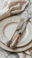 AI generated Elegant Table Setting With White Plate, Silverware, and Flowers photo
