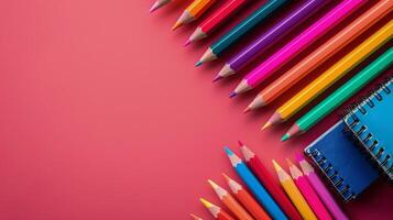 AI generated Group of Colored Pencils and Notebook on Pink Background photo