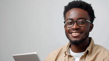 AI generated Man With Glasses Smiling at Laptop photo