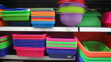 food storage containers and kitchen utensils on supermarket shelves for sale photo