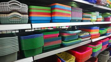 food storage containers and kitchen utensils on supermarket shelves for sale photo