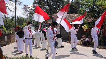 Ambarawa, August 17th 2023. Indonesian students bring red white flags in ceremony celebrating Independence Day. photo