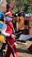 Drummers in red and white uniforms march in the Indonesian Independence Day parade photo