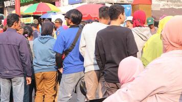 crowd of happy people participate in the carnival in the street block photo