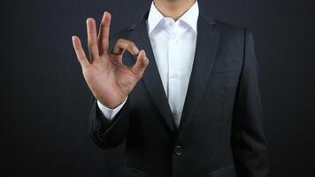 Business man hand with ok sign on white background photo
