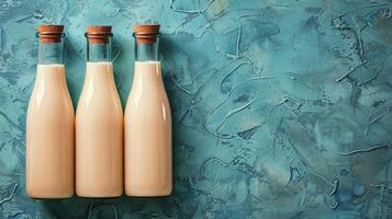 Three Bottles of Milk Hanging on a Wall photo