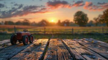 tractor estacionado en campo a puesta de sol foto