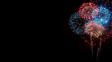 Vibrant Fireworks Exploding in Night Sky photo