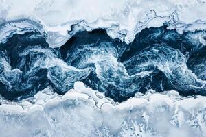 ai generado De arriba hacia abajo aéreo ver de un glacial río con intrincado patrones, demostración contrastando oscuro agua en contra blanco nieve. foto