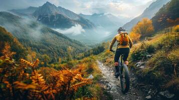 Man Riding Mountain Bike Down Trail photo