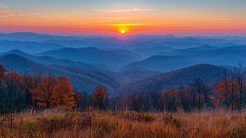 Sun Setting Over Mountain Range photo