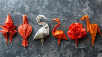 grupo de origami aves en mesa foto