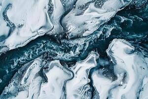 AI generated Top-down aerial view of a glacial river with intricate patterns, showing contrasting dark water against white snow. photo