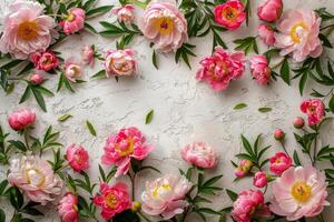 AI generated Creative layout of pink peony blossoms and foliage on a white concrete background photo