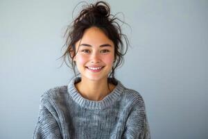 AI generated Person with a warm smile wearing a casual grey sweater against a plain background photo