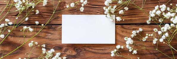 Blank Paper Surrounded by Dried Flowers photo