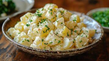 Wooden Bowl Filled With Potato Salad on Table photo