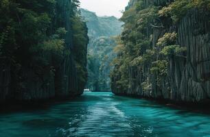 Boat Traveling Down River Surrounded by Mountains photo