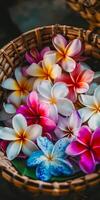 vibrante plumeria flores en un tejido cesta arreglo foto