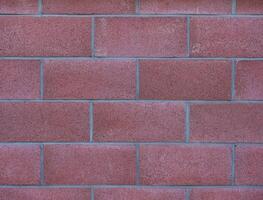 red concrete block wall background photo