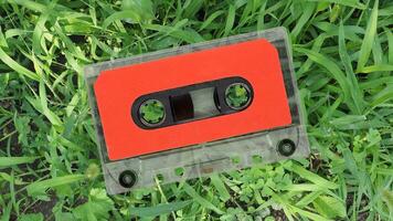 magnetic tape cassette over grass photo