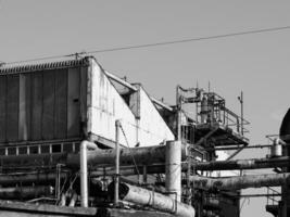 abandoned factory ruins in black and white photo