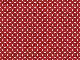 texturised white color polka dots over firebrick red background photo