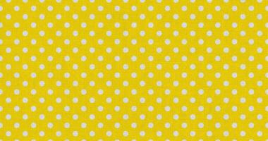 white yellow color polka dots fabric photo