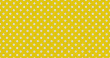 white yellow color polka dots fabric photo