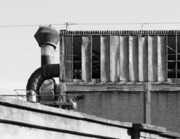 abandoned factory ruins in black and white photo