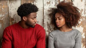 Young Couple in Disagreement Against Rustic Background photo