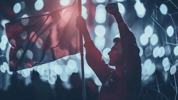 Silhouetted Figure Waving Flag at Dusk Amidst Lights photo