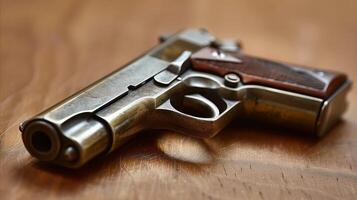 Close-Up of Vintage Handgun on Wooden Surface photo