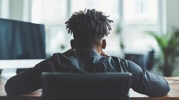 Man Working at His Desk in a Modern Office photo