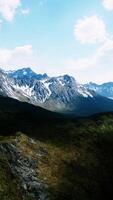 Aerial Over Valley With Snow Capped Mountains In Distance video