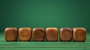 Wooden Blocks Lined Up on Striped Green Background photo