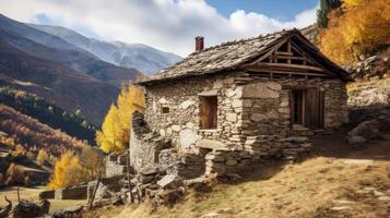 Stone house nestled in mountain landscape photo
