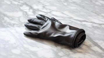 Refined leather glove resting on smooth marble photo