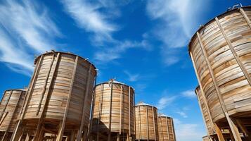 Wooden grain silos under blue sky photo