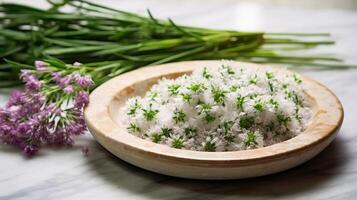 Freshly harvested chive blossoms on marble tray photo