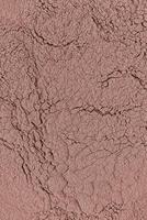 Bronze Tone Decorative Powder Dry Powder Texture for Dark Face Makeup, Tanned Skin. Vertical abstract background. layout. photo