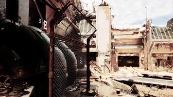 A dilapidated building surrounded by a rusted chain-link fence video