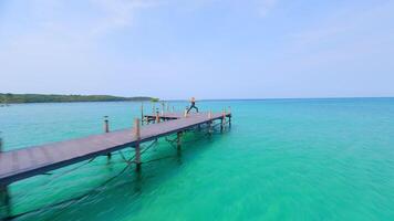 Caucasian woman practicing yoga by the sea video