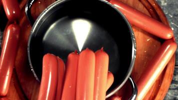 Super slow motion falling sausages. High quality FullHD footage video