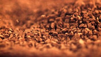 Super slow motion pellets of instant coffee fall . Filmed on a high-speed camera at 1000 fps. High quality FullHD footage video